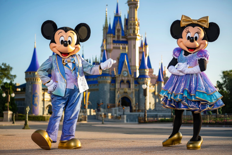 Mickey and Minnie Mouse in their sparkling new looks made for the 18-month 50th anniversary event. Select Happy Meal toys in the McDonald's collection will also wear "EARidescent" outfits.