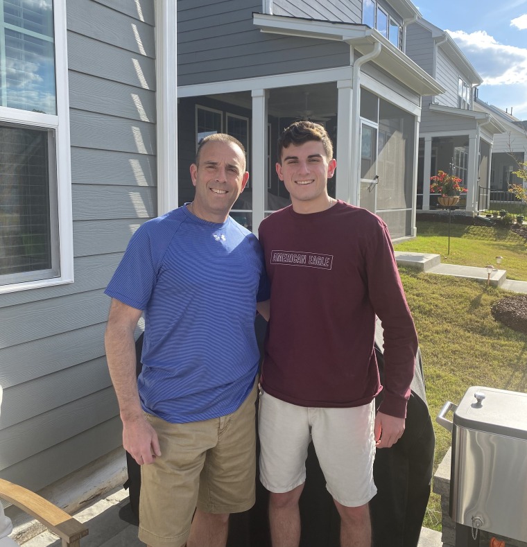 Thomas Caputo, right, shares a happy moment with his dad, Charles Caputo. "We can't forget that Sept. 11 wasn't just one day; it's still affecting families, including mine, to this day," he said.