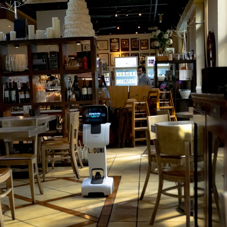 One of the robots at La Duni roams the restaurant.