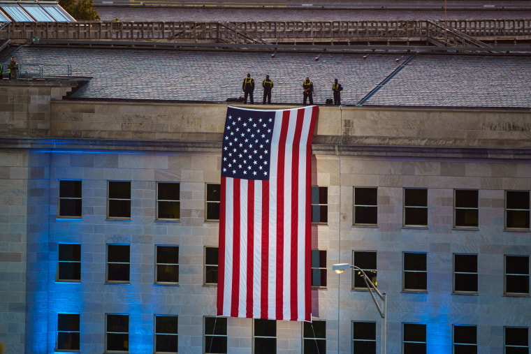 An American flag is unfurled at the Pentagon.