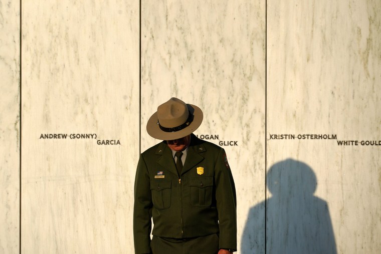 A National Park Service ranger stands in front of the Wall of Names at the Flight 93 National Memorial in Shanksville, Pennsylvania.