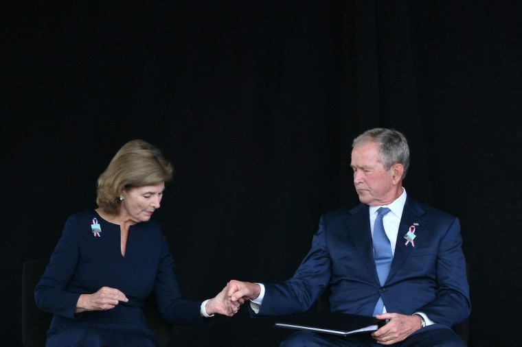 Former US President George W. Bush and former First Lady Laura Bush hold hands in Shanksville, Pennsylvania.