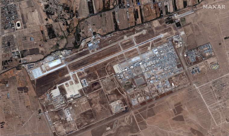Image: Six commercial airplanes are seen near the main terminal of the Mazar-i-Sharif airport