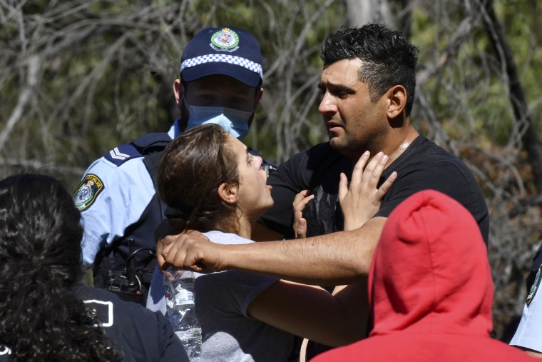 Parents Anthony and Kelly Elfalak embrace after hearing their son AJ was found alive.