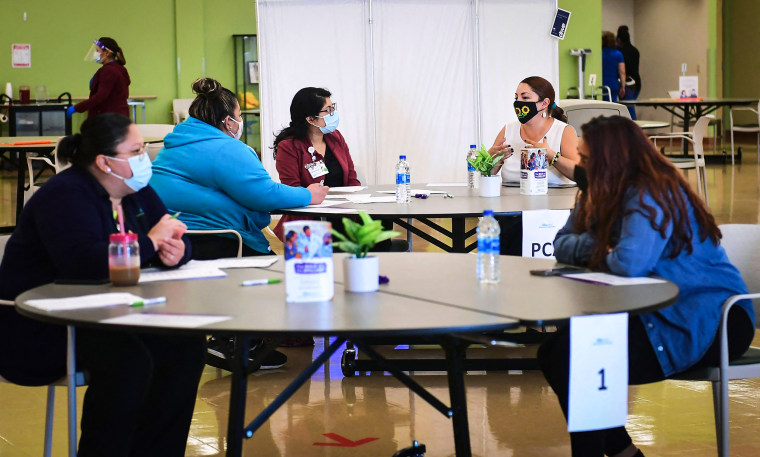 Propspective employees are interviewed during a job fair at AltaMed Health Services on July 9, 2021 in Huntington Park, Calif.