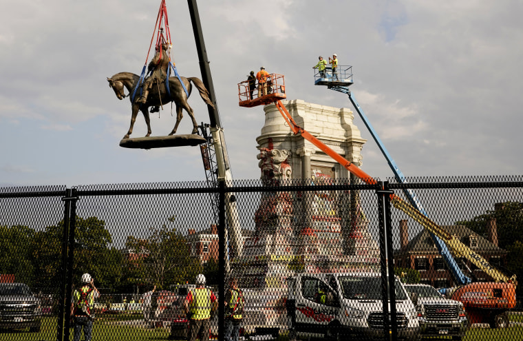 Image: Crews remove a statue of Confederate General Robert E. Lee in Richmond, Va., on Sept. 8, 2021.