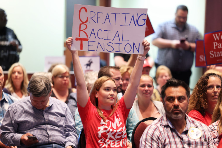 Opponents of critical race theory attend a packed Loudoun County School board meeting until the meeting erupted into chaos and two people were detained in Ashburn, Va., on June 22, 2021.