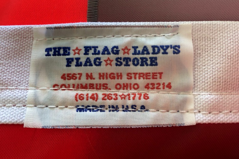 A tag sewn into a flag with the name of The Flag Lady store in Columbus, Ohio, which is owned by Lori Leavitt Watson, wife of Judge Michael H. Watson.