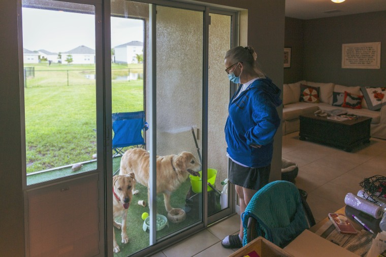 Image: Jennifer Waddleton with her dogs at her home on Sept. 9, 2021 in Lehigh Acres, Fla.