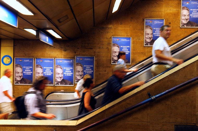 Hungarian government posters portraying financier George Soros and saying "Don't let George Soros have the last laugh" adorn a wall in a train station in Budapest on July 11, 2017.