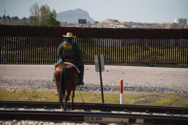 A border patrol agent patrols on horseback in Sunland Park, N.M., on Sept. 9, 2021.