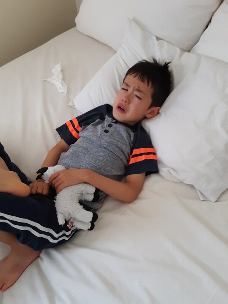 JiaYing Grygiel's son is pictured feeling miserable after catching COVID-19.