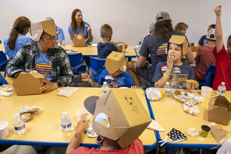 Children displaced by the Caldor Fire eat lunch at The Discovery Museum. 