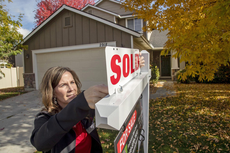 Rebecca Van Camp, a real estate broker, outside a home last year in Meridian, Idaho. She started Relocate208, which caters to people moving to the state.