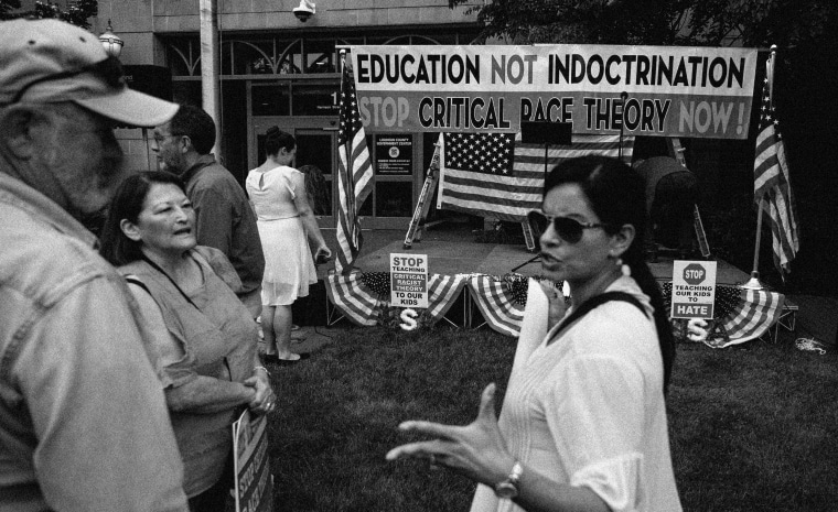 IMage: People gather for a rally against critical race theory at the Loudoun County Government center in Leesburg, Va., on June 12, 2021.
