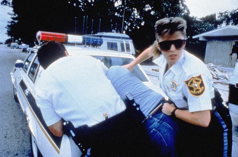 Image: Police officers in Broward County, Fla., restrain a suspect in a 1989 episode of \"COPS.\"