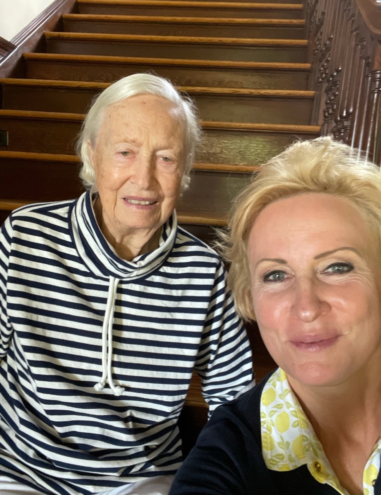 Mika Brzezinski and Emilie Brzezinski taking a rest halfway up the stairs.