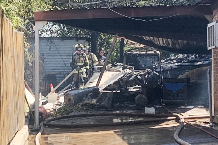 Emergency crews respond to the site of a plane crash in Lake Worth, Texas, on Sept. 19, 2021.