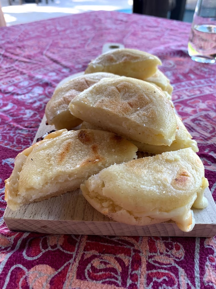 My freshly made arepas stuffed with cheese.