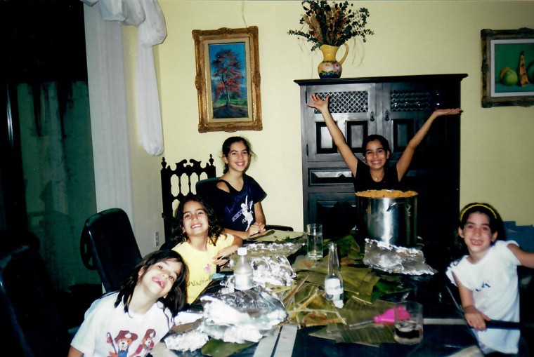 My sisters and I cooking at our home in Miami in 2000 (I'm the one with my hands in the air!).