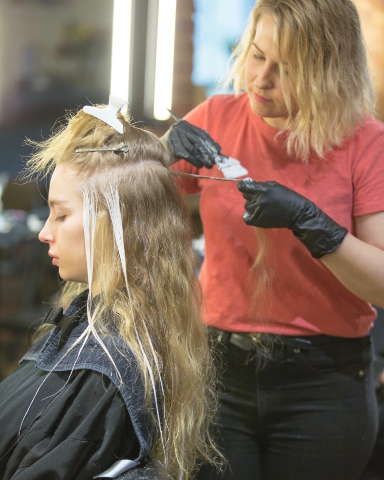 Lena Ott, founder and color director of Suite Caroline Salon in New York City, working on a client.