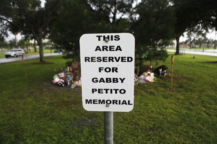 A sign indicates a designated area for a memorial to Gabby Petito in North Port, Fla., on Sept. 21, 2021.