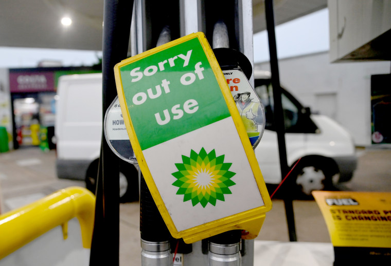 Image: Out of use signs are placed over pumps at a Shell petrol station in London