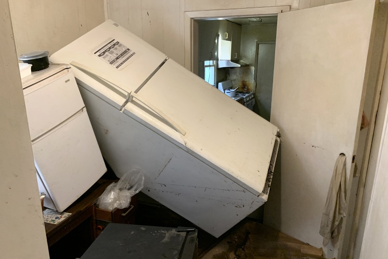 Image: Damage to the first floor of Johnson Ho's apartment building, where four lower-income Asian Americans lived in one unit.