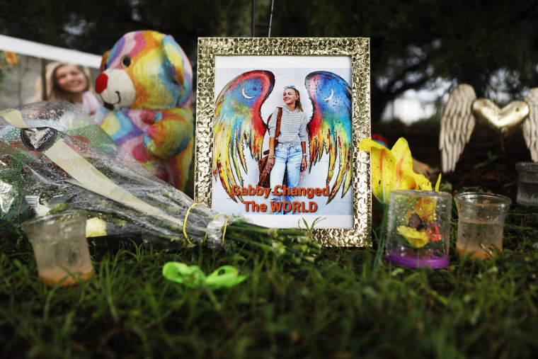 Flowers and photographs adorn a makeshift memorial dedicated for Gabby Petito in North Port, Fla., on Sept. 21, 2021.