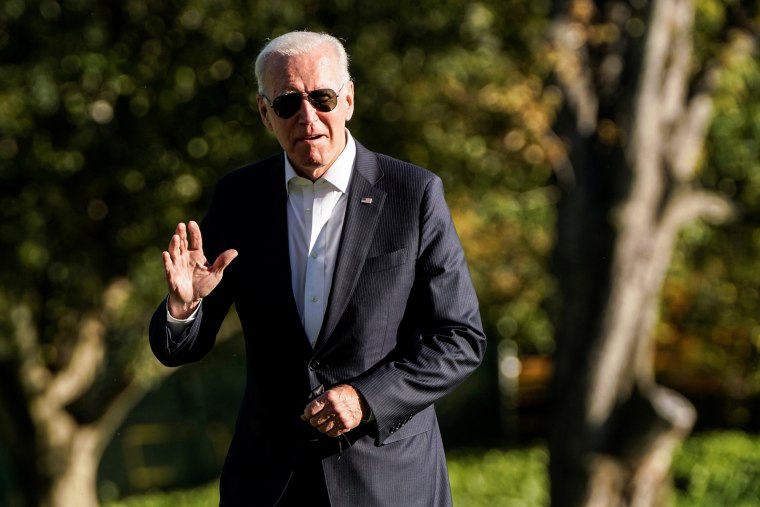 Image: U.S. President Joe Biden walks from Marine One as he returns to the White House in Washington