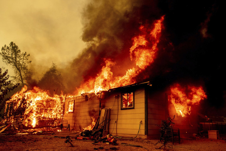 Image: Firefighters battle the Fawn Fire burning north of Redding in Shasta County