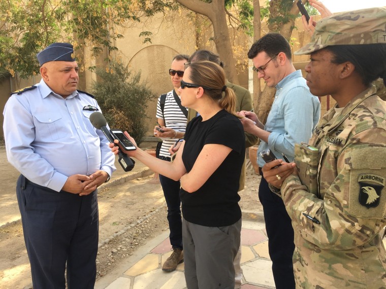 Kube interviewing an official in Baghdad.