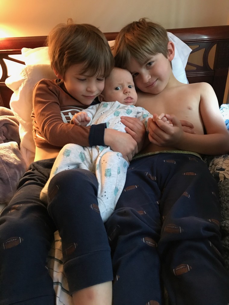 Kube's twin sons Ryan and Jake with their baby brother, AJ.