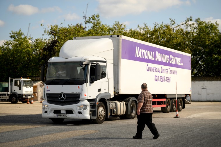 Image: A student at a heavy goods vehicle training center in Croydon, England
