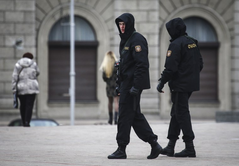 Armed police officers patrol Oktyabrskaya Square in Minsk, Belarus March 24, 2017.