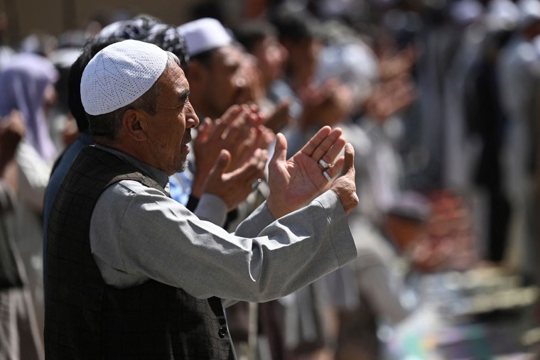 Image: Members of the Hazara community offer Friday prayer outside a mosque on the outskirts of Kabul, Afghanistan, on Sept. 10, 2021.
