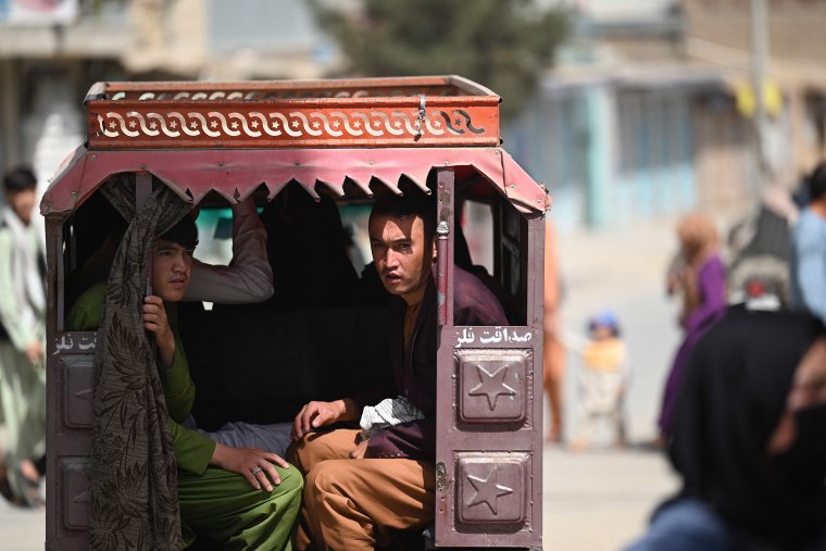 Image: Hazara men travel on a three-wheeler vehicle on the outskirts of Kabul, Afghanistan on Sept. 10, 2021.