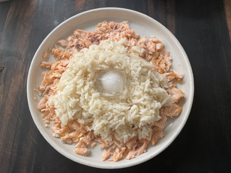 Mashing the salmon and placing an ice cube in a well in the rice keep this dish moist.