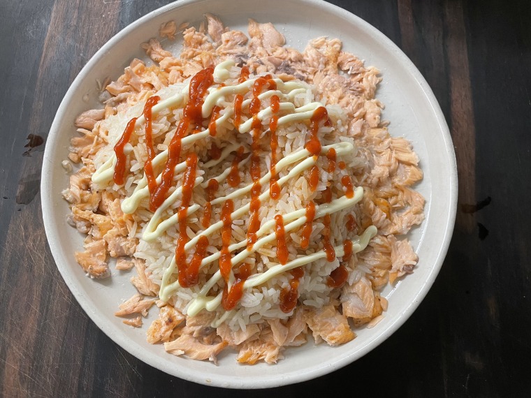 Squeeze a pretty little zig zag of Kewpie and Sriracha on top of the rice and mix, mix, mix.