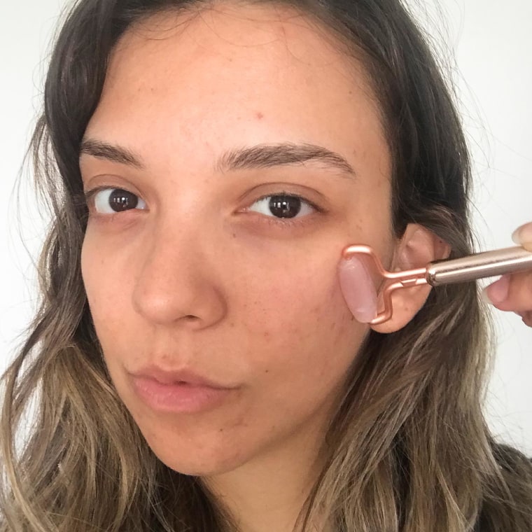 Writer Cailey Rizzo holding one of the the Nudestix 5-1 tools