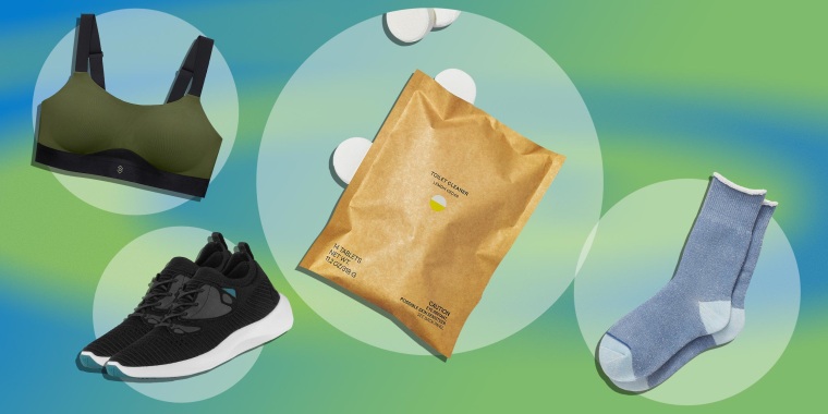 Paid of blue Brooklinen socks, Green sports bra from ThirdLove's new activewear collection, pair of black sneakers from Vessi and Blueland toilet bowl cleaner
