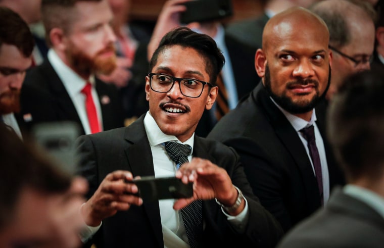 Conservative online activist Ali Alexander takes a picture in the East Room of the White House on July 11, 2019.