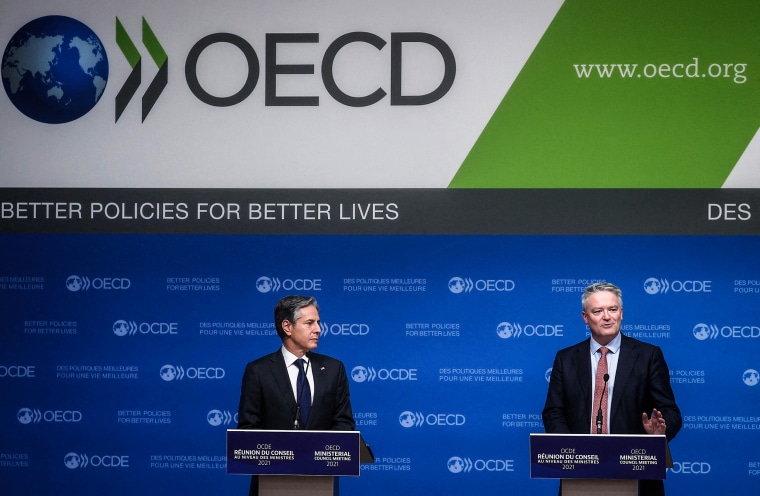 Image: Secretary-General of the Organization for Economic Cooperation and Development (OECD) Mathias Cormann, right, and U.S. Secretary of State Anthony Blinken hold a closing press conference at the 60th OECD Ministerial Council Meeting on Oct. 6, 2021,
