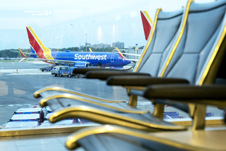 A Southwest Airlines plane remains at the gate at Ronald Reagan National Airport in Arlington, Va., on May 25, 2021.