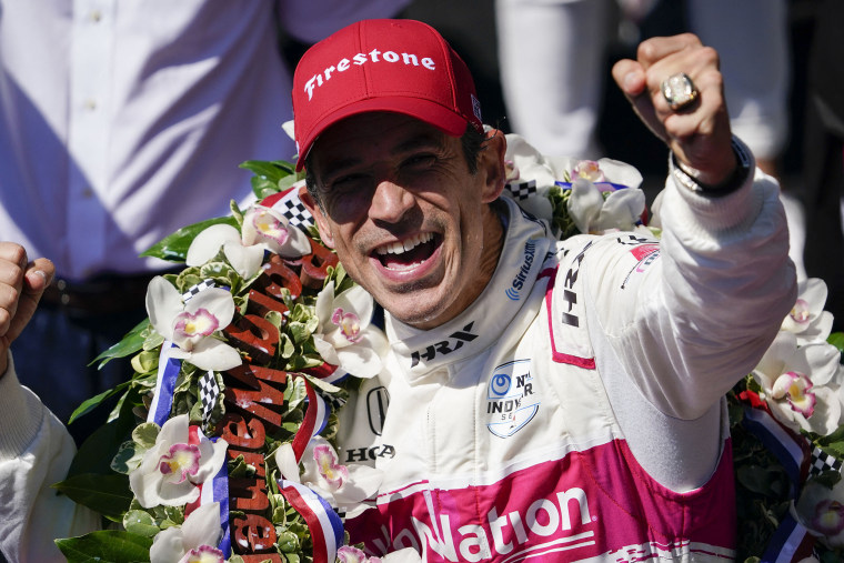 Helio Castroneves celebrates after becoming the fourth driver in history to win the Indianapolis 500 auto race four times at Indianapolis Motor Speedway on May 30, 2021 in Indianapolis.