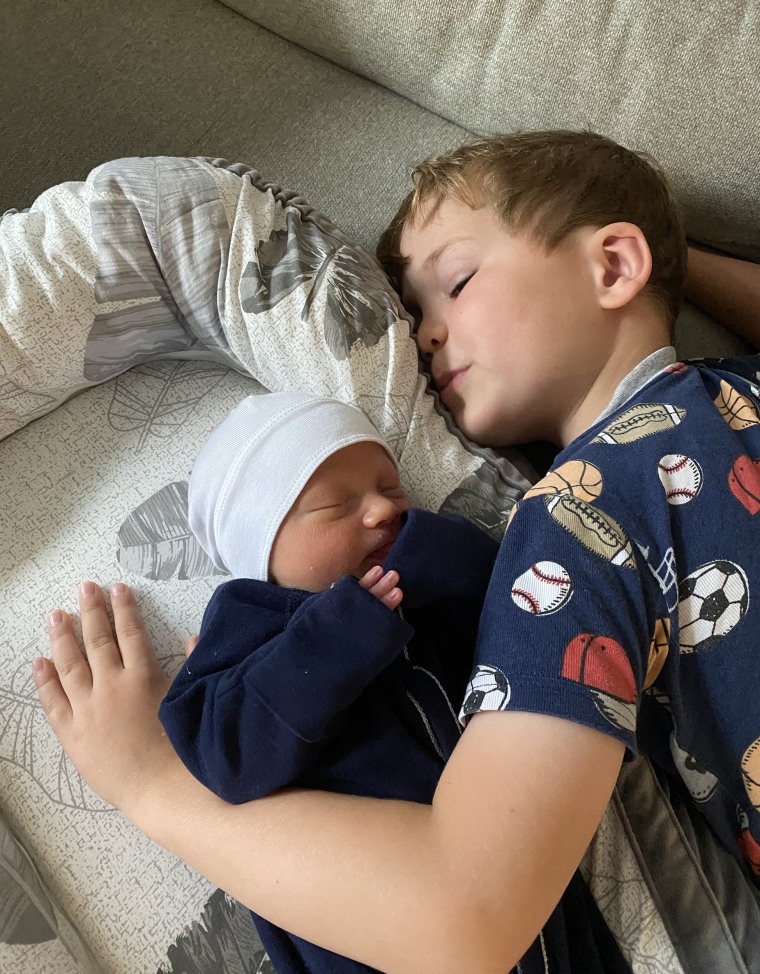 Calvin snuggled up with baby Rusty.