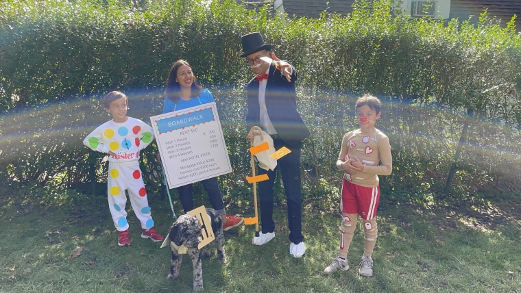 Family wearing board game Halloween costumes