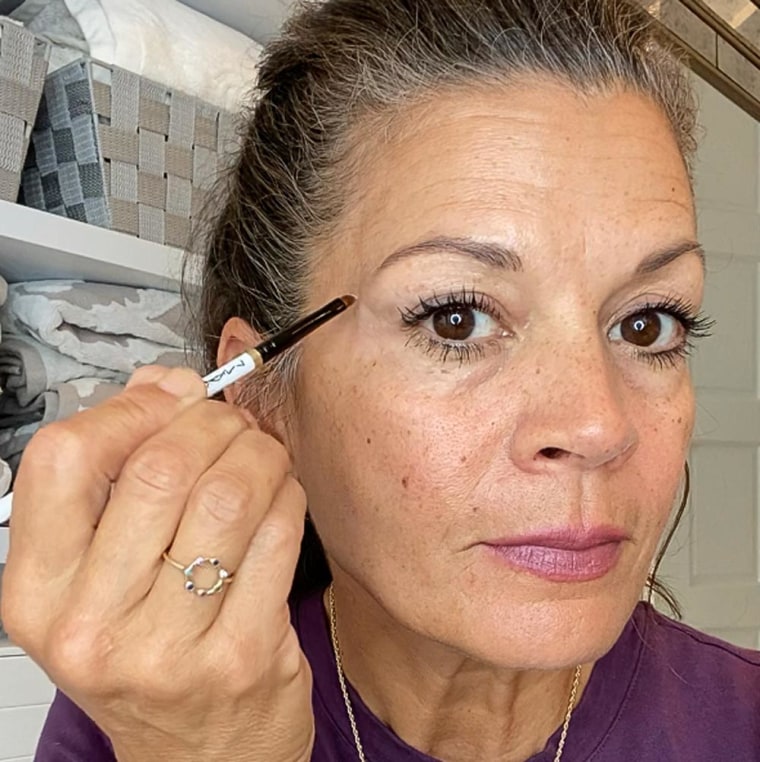 Image of writer Dina Eastwood using the Peter Thomas Roth Eye Tightener cream