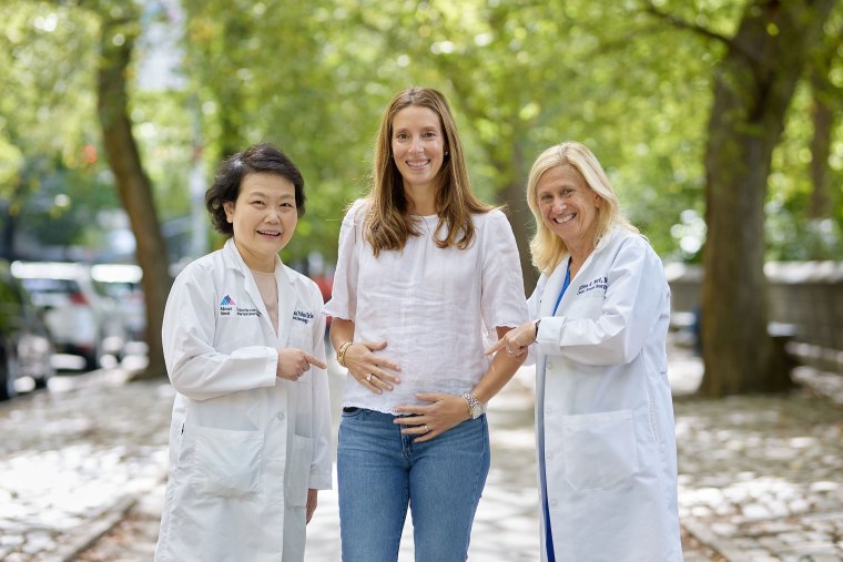 After being cancer-free for five years, Julie McAllister is pregnant and appreciates the expertise of her doctors at Mount Sinai, Dr. Hanna Irie (left) and Dr. Elisa Port (right). 