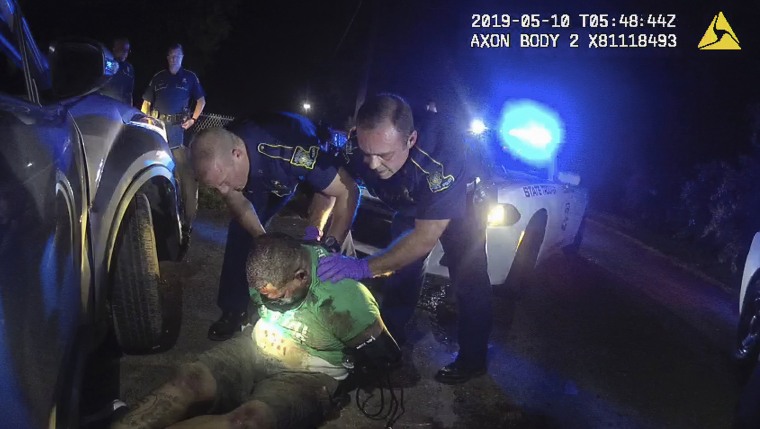 Image: This image from video from Louisiana state police state trooper Dakota DeMoss' body-worn camera, shows troopers holding up Ronald Greene before paramedics arrived on May 10, 2019, outside of Monroe, La.
